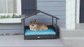 Load and play video in Gallery viewer, Elevated Wicker Rattan Dog House Outdoor with Canopy & Water-Resistant Cushion, Blue