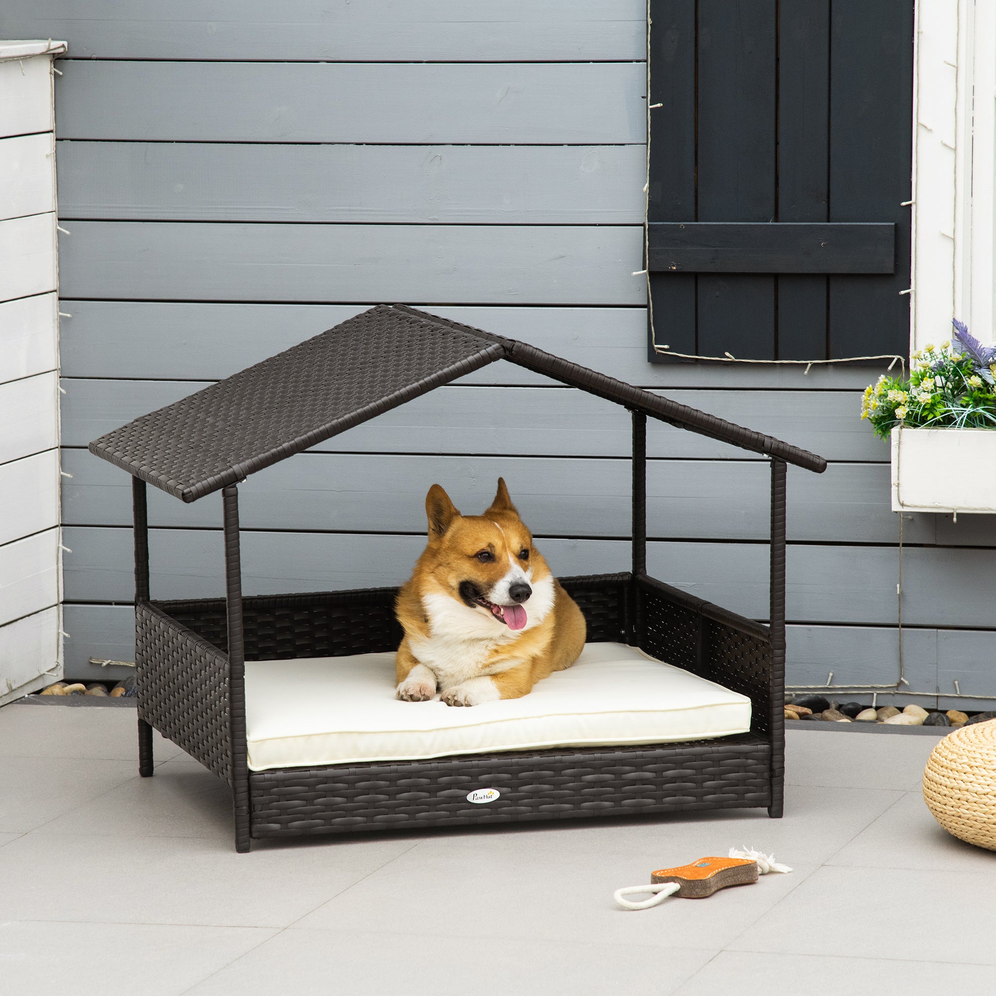 PawHut Wicker Dog House Outdoor with Canopy, Rattan Dog Bed with Water-resistant Cushion, Raised Dog Bed for Small, Medium Dogs up to 66 lbs, 19.75" in Length, Brown Wicker, White Cushion