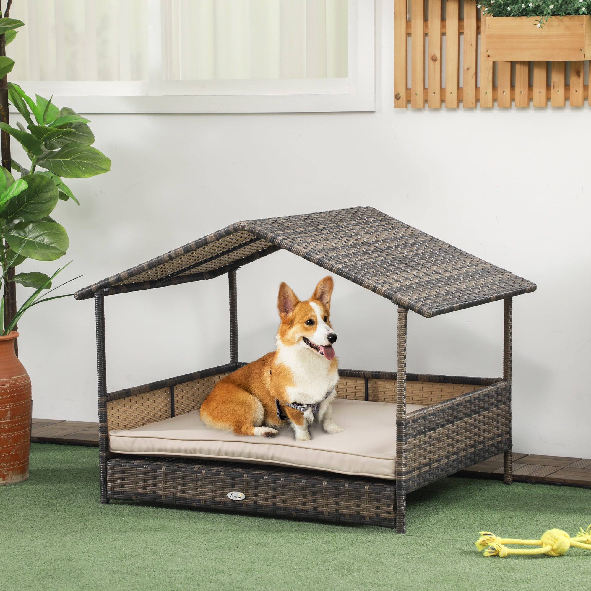 PawHut Wicker Dog House Outdoor with Canopy, Rattan Dog Bed with Water-resistant Cushion, Raised Dog Bed for Small, Medium Dogs up to 66 lbs, 19.75" in Length, Brown Wicker, Khaki Cushion